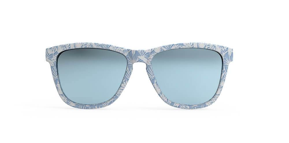 Front view blue frames with all over palm leaf print and blue lens sunglasses with polarized, uv protection, and reflective lenses